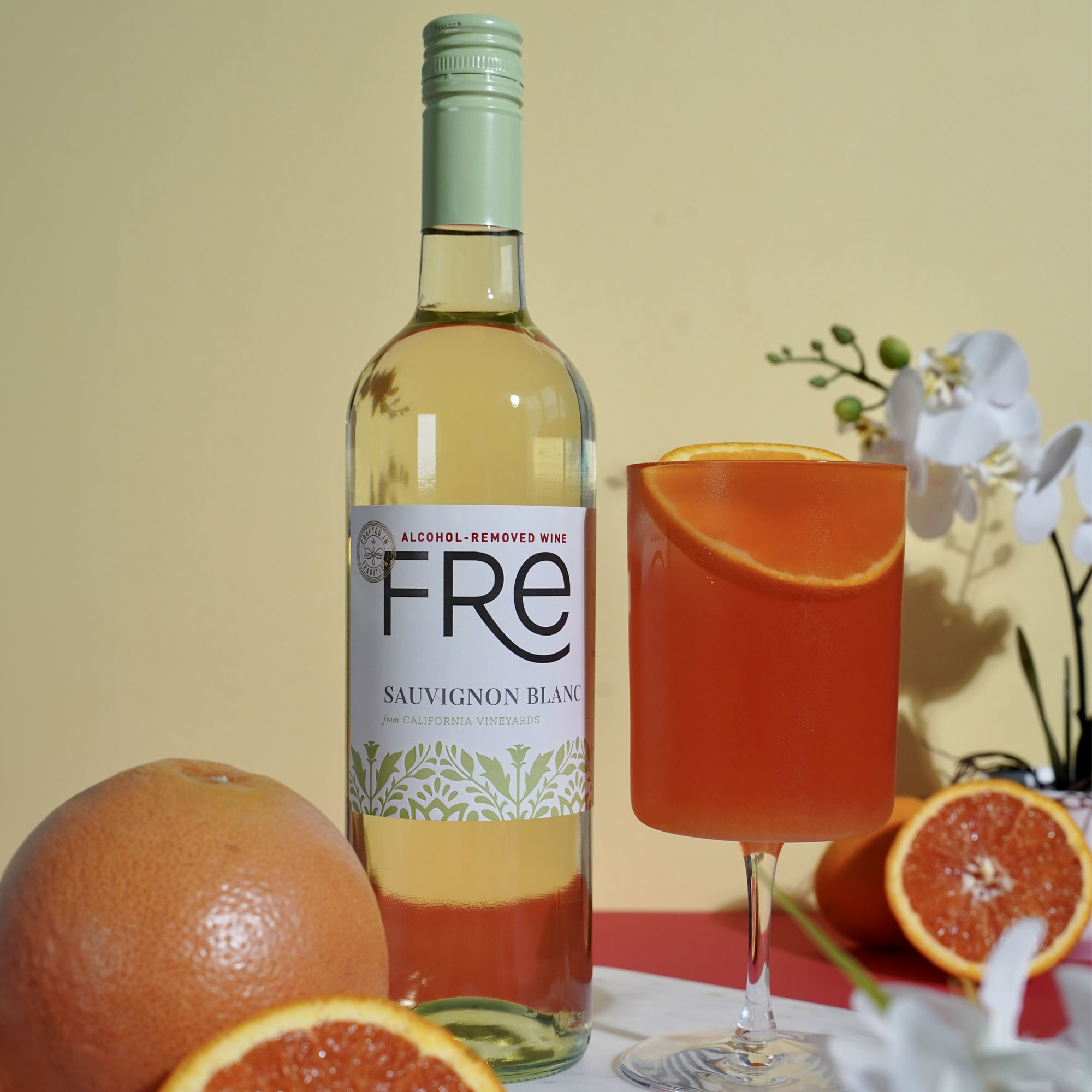 FRE Italian Sangria with Sauvignon Blanc bottle, oranges, and glass