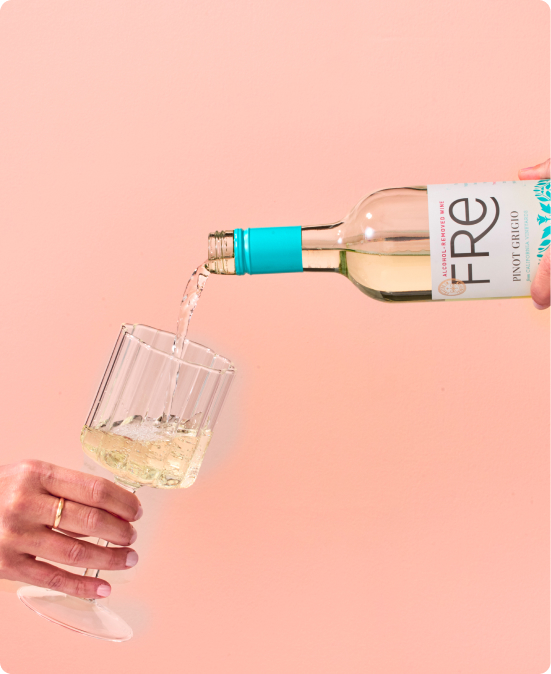 Bottle of Fre Alcohol-Removed wines pinot grigio being poured into a wine glass