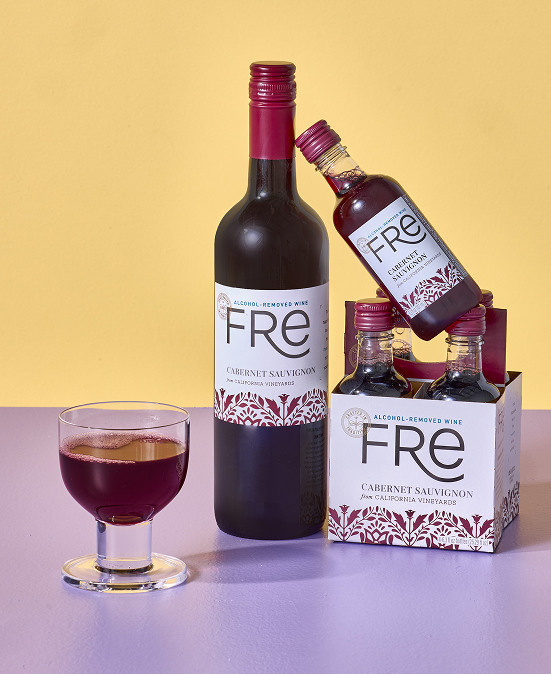 Full size and 187ml bottles of Fre Alcohol-Removed Cabernet Sauvignon red wine are arranged next to a glass of red wine