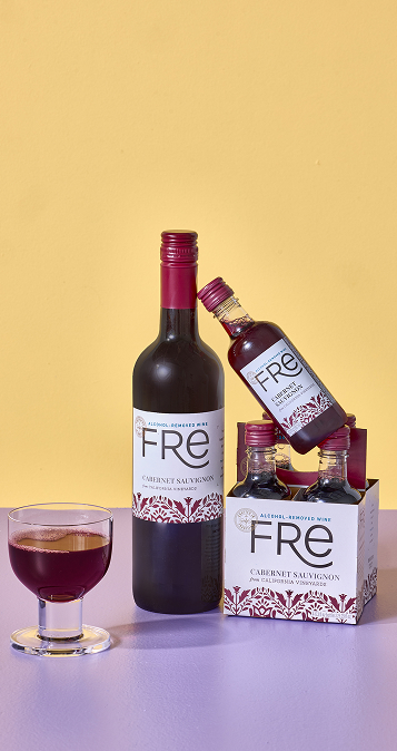 Full size and 187ml bottles of Fre Alcohol-Removed Cabernet Sauvignon red wine are arranged next to a glass of red wine