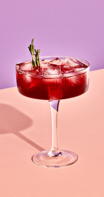 A mocktail in martini style glass made with Fre alcohol-removed wine