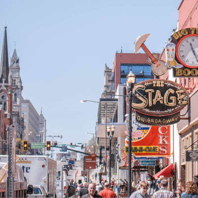 Busy street scene with multiple businesses and signs